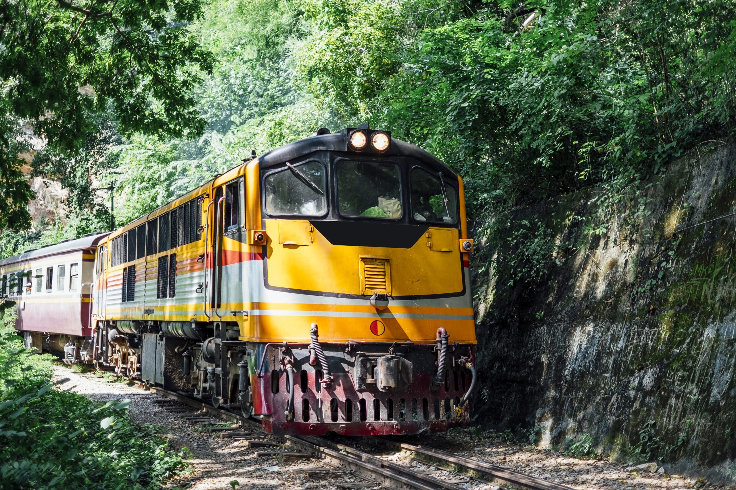 Old passenger train on the tracks in Thailand