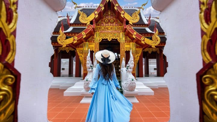 Tourist visiting a Buddhist temple in Chiang Rai, northern Thailand