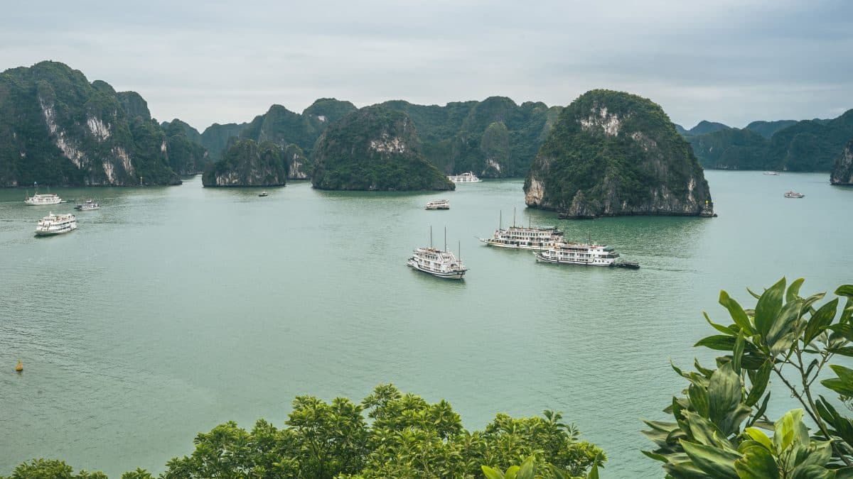 Aerial view of limestone islands and boats in Ha Long Bay, Vietnam