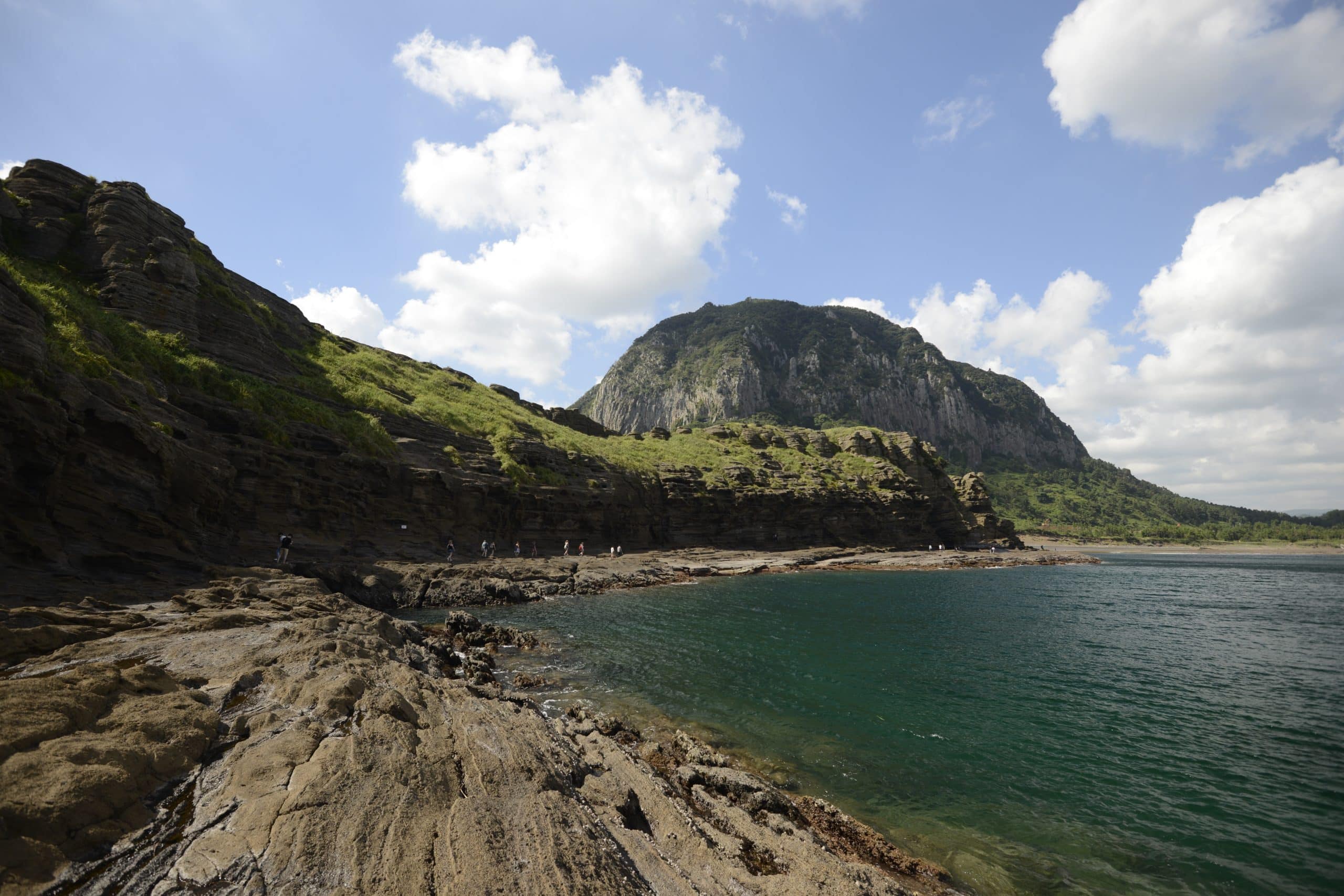 Large volcanic rock formations on the coast of Jeju Island