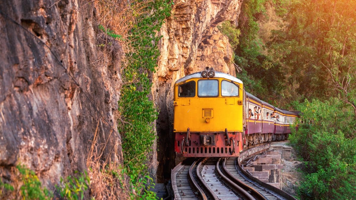 Old Thai passenger train on the railway at Kanchanaburi, Thailand