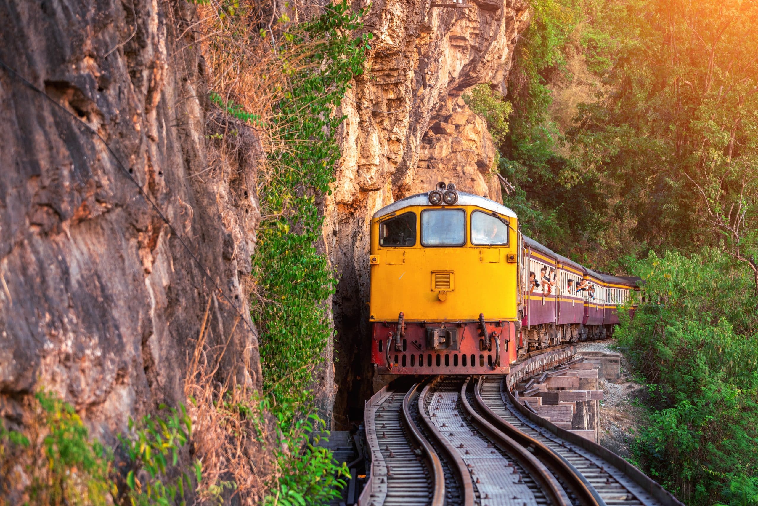 Old Thai passenger train on the railway at Kanchanaburi, Thailand